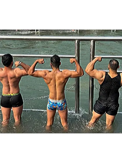 Flexing with friends in the Ganga. We share a bond of both fitness and faith.