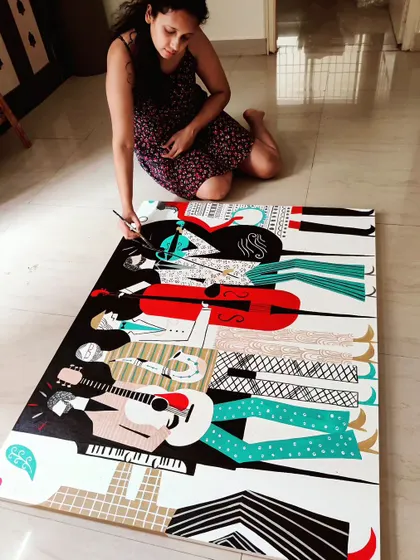 Painting the large musical themed canvas on my studio floor. This piece, inspired by the energy of a live band, involved intricate patterns and a bold color palette to capture the feeling of music in visual form.