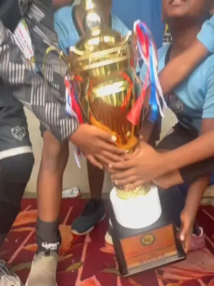Our U10 boys holding their winners' trophy high after a successful tournament at Gamechanger Mathikere.