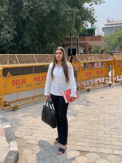 At your defense, standing outside Saket Court. I am ready to represent you and protect your interests.