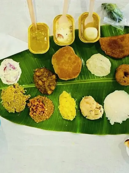 A modern take on the traditional meal, with items served in bowls and cups on the banana leaf for convenience. This is great for buffet-style events.