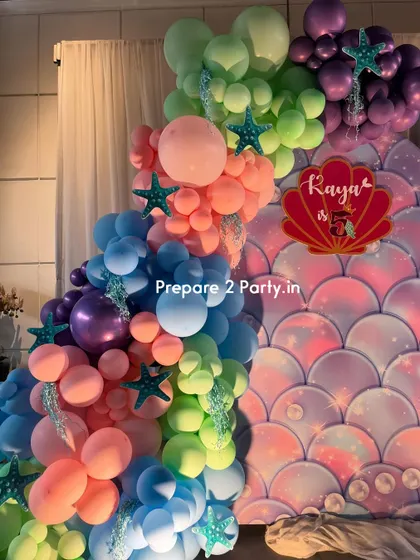 Explore my portfolio of mermaid themed birthday parties, featuring iridescent backdrops, shell-shaped signs, and balloon arrangements that capture the magic of the ocean.
