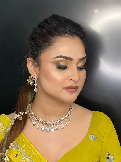 Another angle of the sophisticated engagement makeup, showing how the contour and highlight catch the light to define the facial structure.