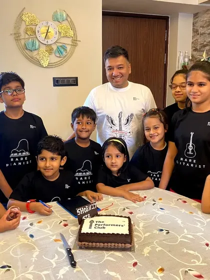 **A Table Full of Champions.** Our Mumbai students gathered to celebrate their hard work and passion for music. These meetups reinforce the strong bonds we build within our online community.