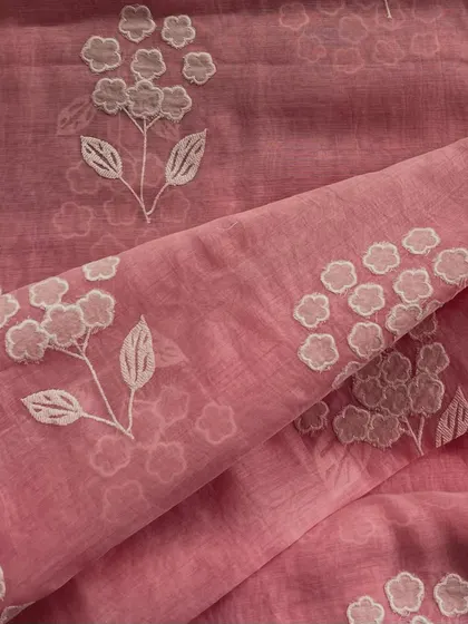 This pink Mul Chanderi with delicate white appliqué work offers a soft and feminine look. The featherlight fabric is perfect for elegant kurtas and dresses.
