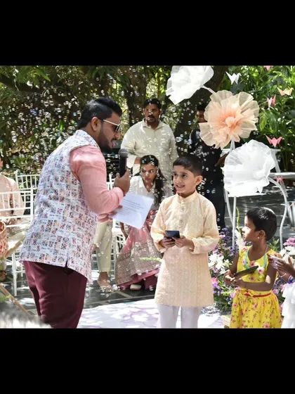 A candid moment interacting with the kids during a colorful Haldi. I make sure the little ones have fun too.