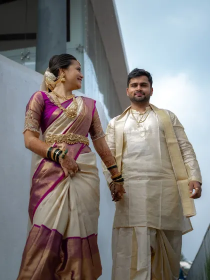 A low angle shot capturing the couple as they walk together. The bride's smile towards her partner shows the genuine happiness and connection I strive to document.