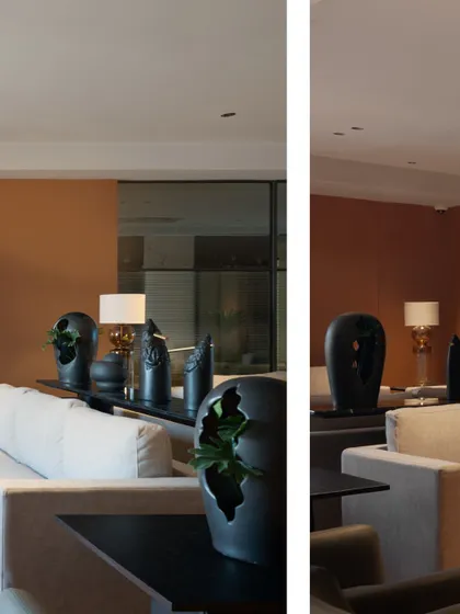 A different angle of the Jubilee Headquarters waiting lounge, showing the arrangement of seating and the abstract black sculptures on the console table. Every element is carefully chosen to contribute to the overall aesthetic.