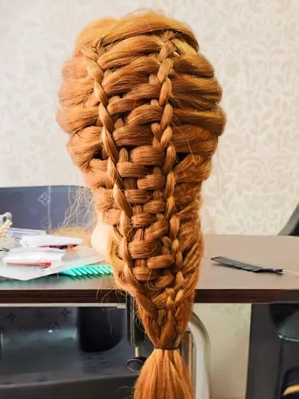 A complex basket-weave braid, demonstrating the advanced techniques students learn in my hairstyling course.