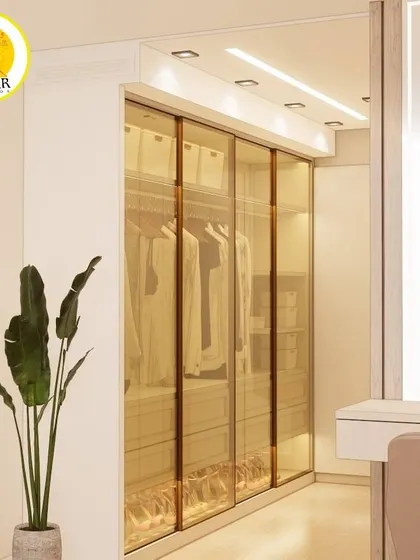Another view of the gold-tinted glass wardrobe, showing how it becomes a beautiful feature in the bedroom.