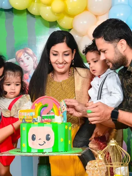 A vibrant 'Super Mario' themed birthday party, with character cutouts, a custom backdrop of the Mushroom Kingdom, and red and green balloons, ready for an adventure.