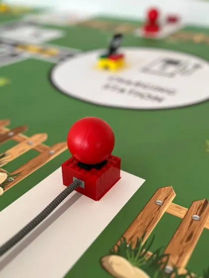 A detailed shot of a game element on the IRO Innovators mat. Students must design their robots to interact with these specific pieces to score points.