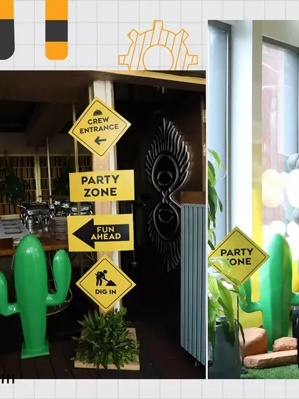 Themed signage is key to an immersive experience. Here are some fun, construction-style signs pointing guests to the "Party Zone."
