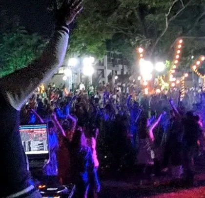 Raising a hand to hype up the 2,000+ crowd at the corporate Holi festival.