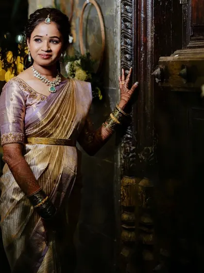 A classic pose showcasing the full reception attire. The draping of the saree, the placement of the jewelry, and the elegant hairstyle all come together to create a look of grace and sophistication.