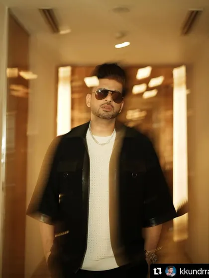 Styling Karan Kundrra in a cool, edgy look featuring a black jacket with leather details. This motion-blur shot captures the dynamic energy of the outfit.