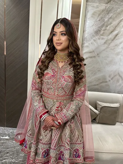 This bride opted for a beautiful peplum-style sharara set. I created a soft glam look with defined eyes and a neutral lip color to match the modern yet traditional outfit.