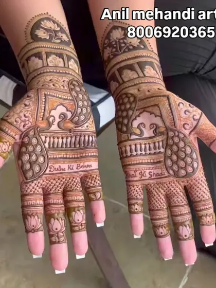 This is a great example of my intricate work for the groom's sister, featuring peacock motifs, lotus details on the fingers, and personalized text reading "Dulhe Ki Behen" and "Bhai Ki Shadi".