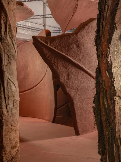 A repeat of image 27, showing a close-up view between the sculptural forms of the 'Terra' installation.