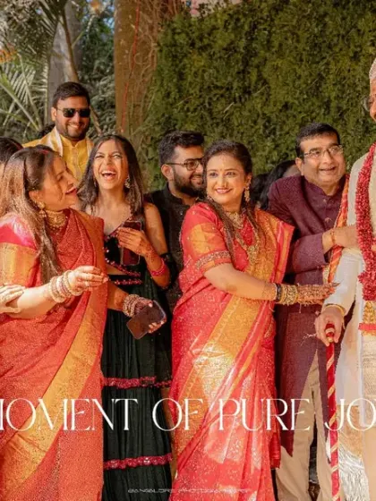 A moment of pure joy, with the groom surrounded by laughing family members. These candid group shots are treasures that capture the spirit of the celebration.