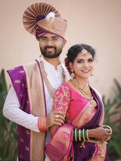 A timeless portrait of the happy couple looking directly at the camera. Their coordinated outfits and happy smiles make this a perfect memory of their special day.