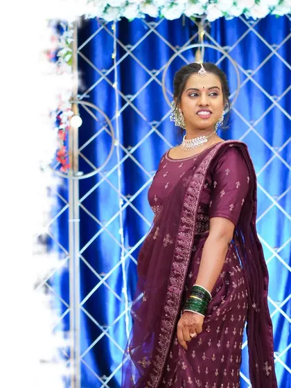 A three-quarter length portrait of the bride against the decorated backdrop. This style of shot is perfect for showing both the person and the event's ambiance.