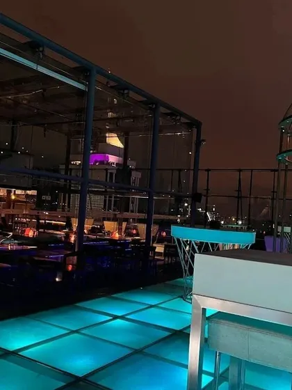 As night falls over Skyye. The colorful lit flooring comes alive, setting the stage for a memorable party.