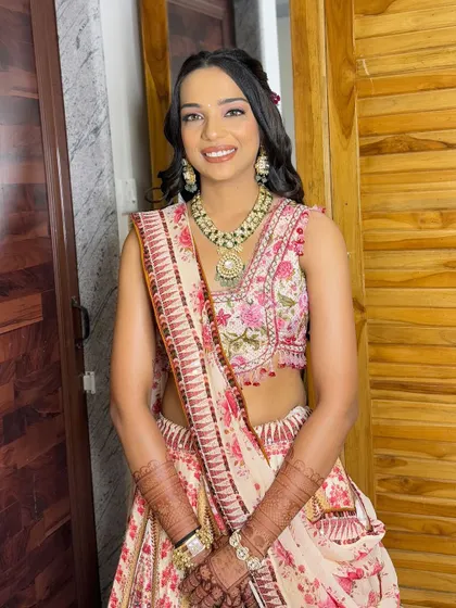 A bright and happy smile. She looks absolutely lovely and ready for the engagement ceremony.