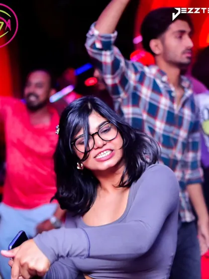 A guest completely lost in the rhythm on the dance floor. My sets are designed to make you forget everything and just dance.