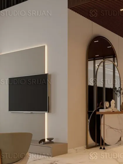 A minimalist TV wall with integrated backlighting, paired with an elegant console table and arched mirrors in this Model Town lobby.