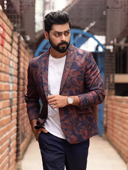 A cinematic walking shot of Tarak Ponnappa in a narrow alley. This type of dynamic image adds energy and movement to a portfolio.