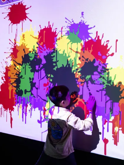 Making a colorful splash on our digital paint wall. It's all the fun of painting without any of the mess!