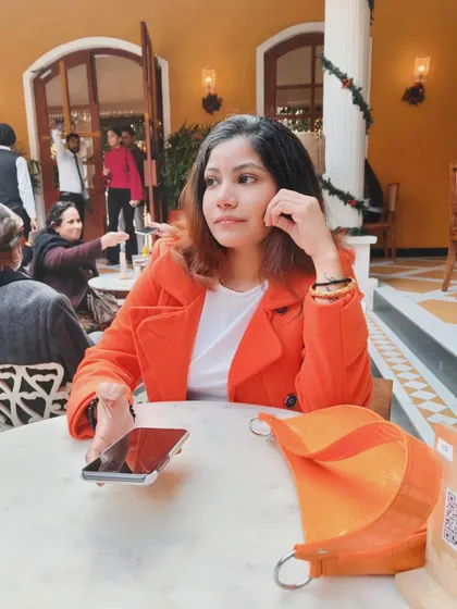A closer look at my lunch outfit. The simple, classic cut of the coat makes the bold color feel sophisticated and wearable for a daytime event.