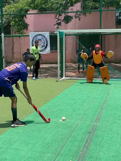 A player prepares for a penalty shootout at our Olympic Day event. These fun competitions bring out the best in our players.