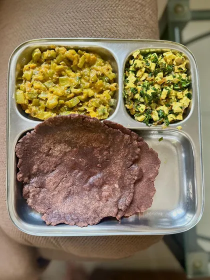 A healthy meal of ragi roti with sautéed bottle gourd and paneer bhurji.