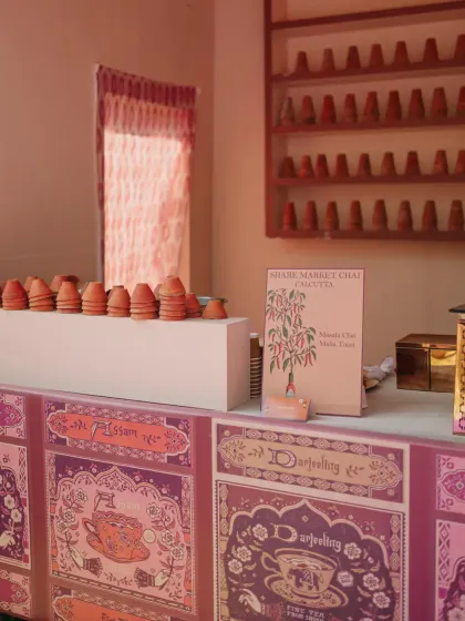 A whimsical "Saturday Market" themed event in Udaipur, with custom-designed stalls for a Chai House, Frozen Yoghurt, and Ice Gola, complete with unique branding and playful decor.