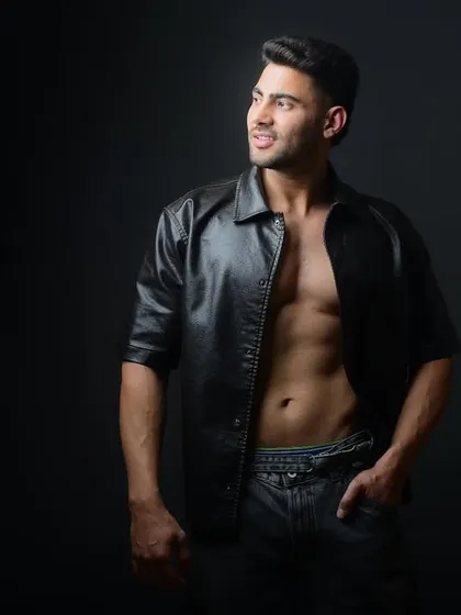 A confident and stylish fitness portrait. The combination of a strong physique and a fashionable look makes for a compelling and modern image.