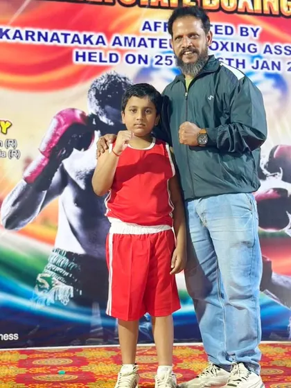 With my student Tanav Sudhakar, who bagged a silver medal in the Cubs Boy's category at the Karnataka State Boxing Championship. It is rewarding to see the youngest boxers compete with such heart.