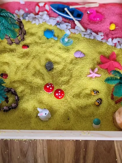 Another beautiful creation, this Zen garden uses yellow and pink sand to create a vibrant landscape. This sensory activity helps children practice focus and express themselves creatively.