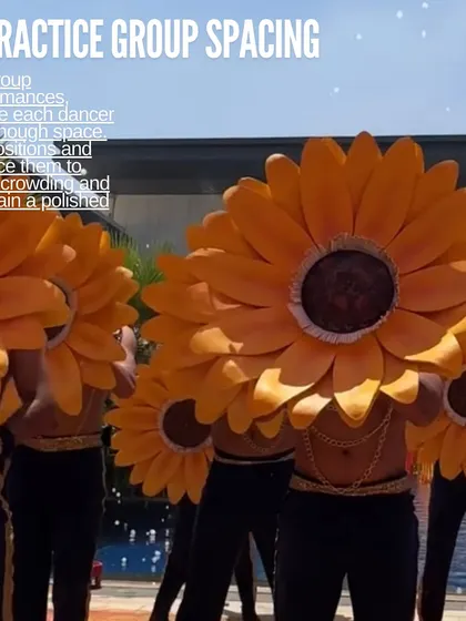 A small tip can make a big difference. For group performances, we ensure every dancer has enough space. Here, our dancers use large sunflower props, and proper spacing is key to creating a clean, polished, and visually impactful look.