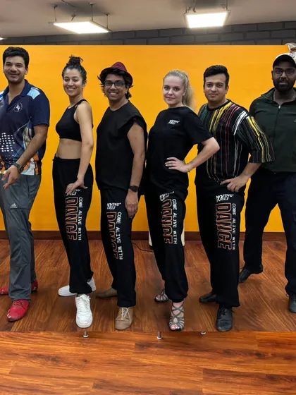 A photo of our team and students at our newly renovated Shivalik studio. The energy and camaraderie are what define us.