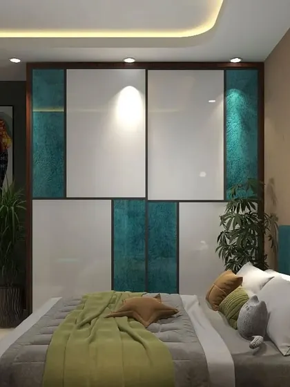 A view from the bed, focusing on the two-tone wardrobe that combines glossy white with a textured teal fabric finish. The design is both luxurious and unique.