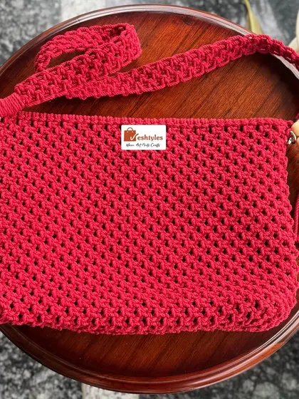 This simple red sling bag with a wooden bead tassel is a classic. It's perfect for adding a pop of color.