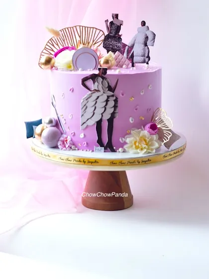 A cake I designed to celebrate a new fashion brand launch. The lavender buttercream cake is decorated with fashion illustration toppers, flowers, and gold details.