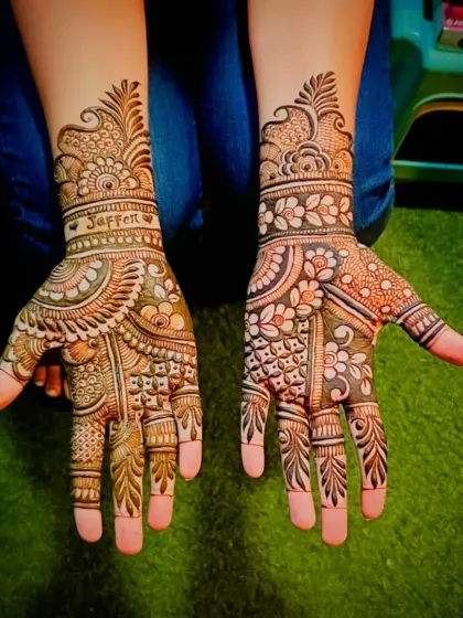 A top-down view of the 'Jaffer' mehandi, showing the complete palm design.