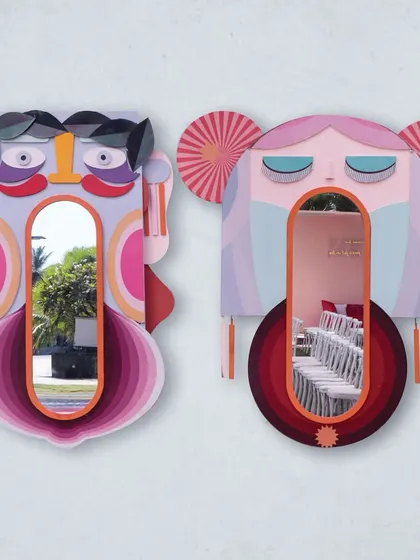 Unique, custom-made mirrors in the shape of abstract faces, reflecting the playful and artistic nature of the carnival theme.