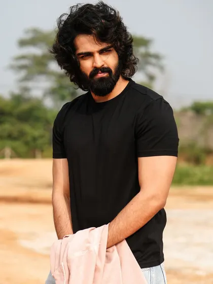 A candid, outdoor shot that feels natural and unposed. This is great for capturing a rugged, athletic look.
