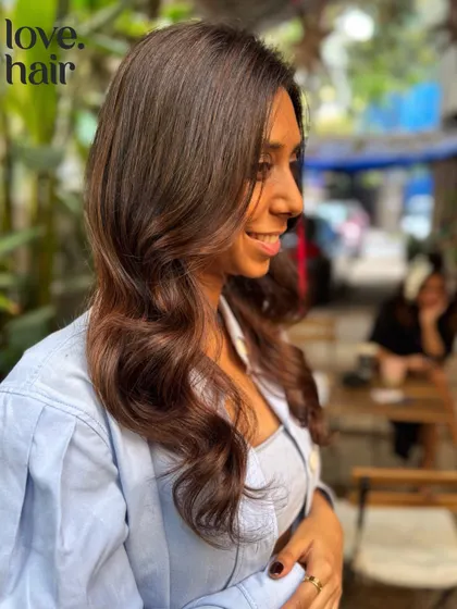 A profile shot of our mocha muse, looking effortlessly chic.