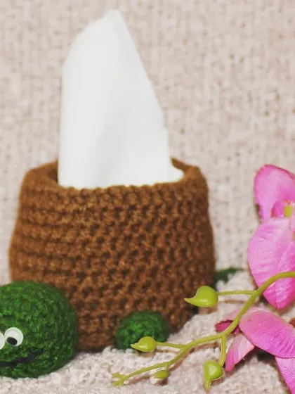 Is it a tortoise? Is it a tissue holder? It's both! This squishy tortoise tissue holder is a fun and quirky addition to any room.