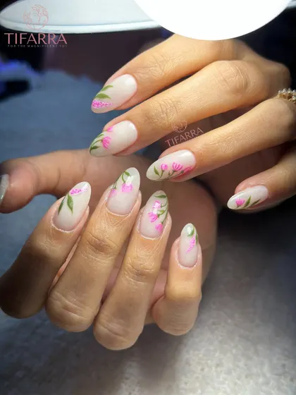 A full view of the elegant hand-painted tulip nails.